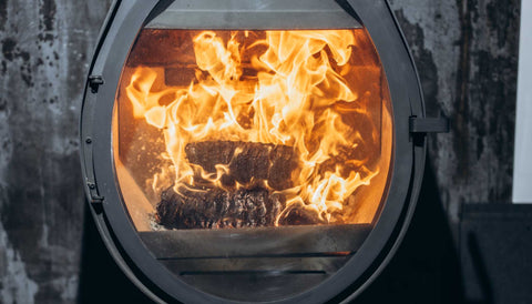 At stove showroom a burning ECOFUEL™ EcoBriquettes bright and warm.