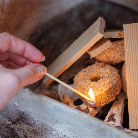 Hand lighting with waxie firelighter and ecofuel kindling sticks